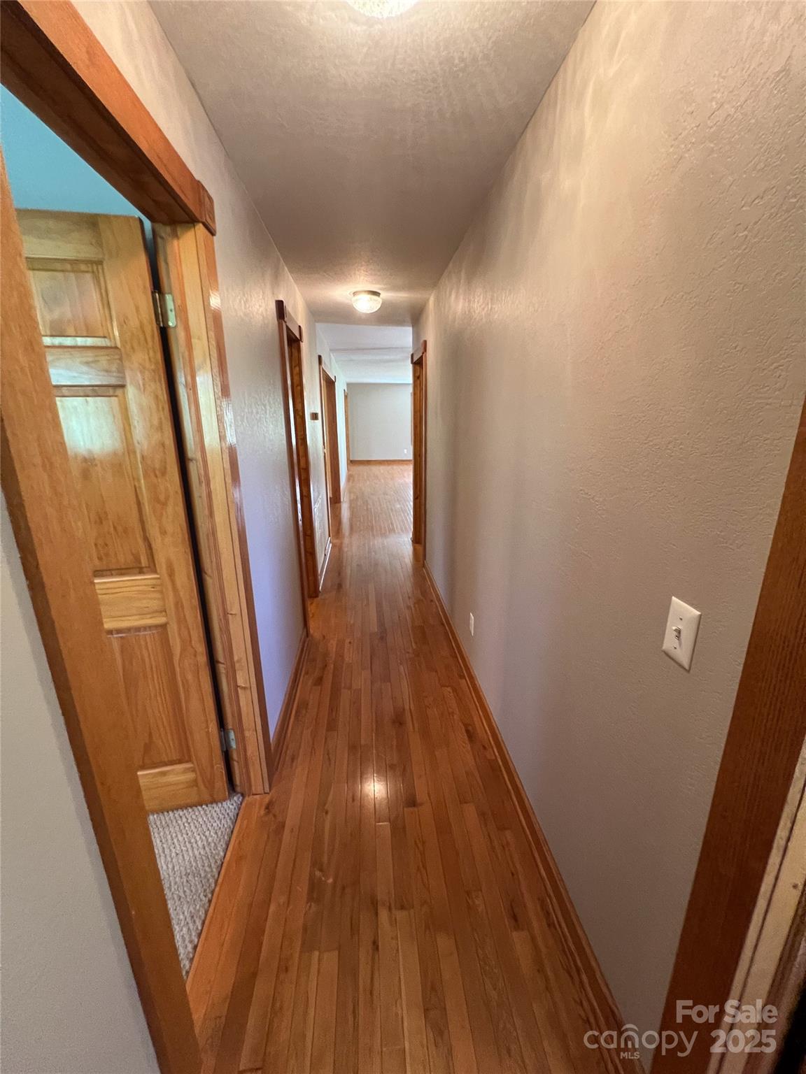 660 Halltown Road Spruce Pine, NC 28777 - Photo 16 of 33 a view of gallery with wooden floor