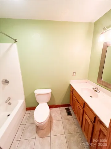 a bathroom with a sink a toilet and a bathtub