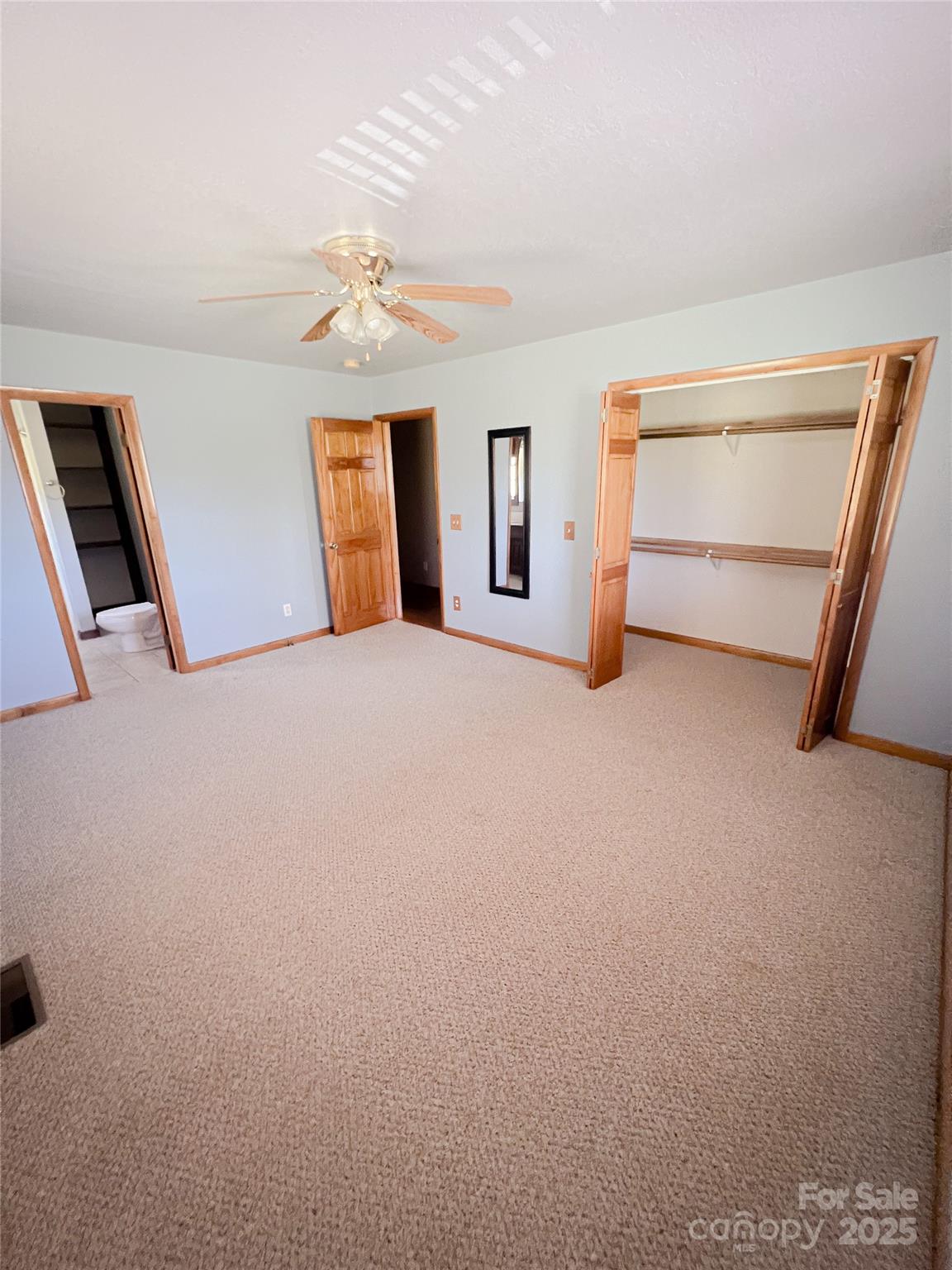 660 Halltown Road Spruce Pine, NC 28777 - Photo 23 of 33 a view of an empty room with closet and windows
