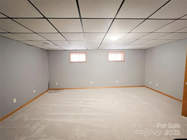a view of a room with lots of wooden floor