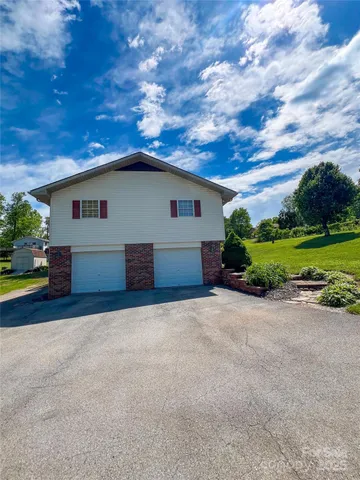 a house view with a garden space