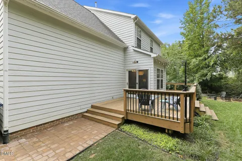 a view of a deck with a small yard