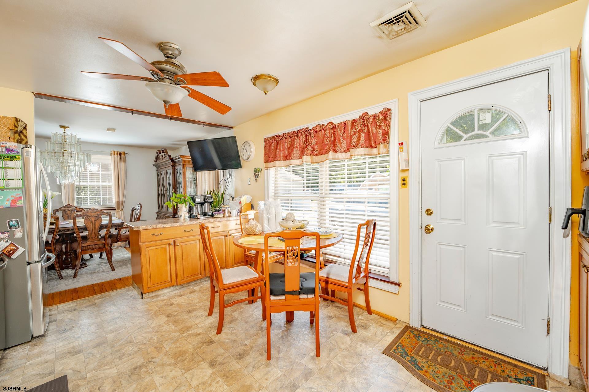 6529 Delilah Road Egg Harbor Township, NJ 08234 - Photo 15 of 70 a dining room with furniture and a floor to ceiling window