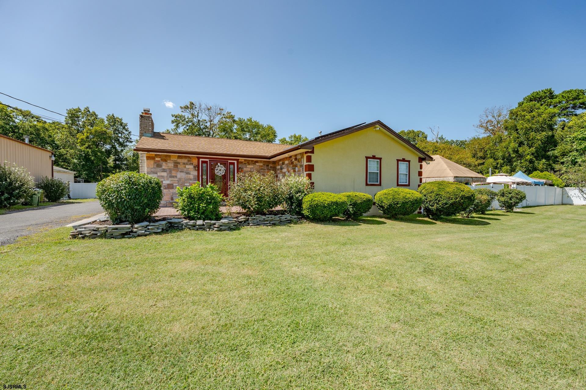 6529 Delilah Road Egg Harbor Township, NJ 08234 - Photo 2 of 70 a front view of a house with garden