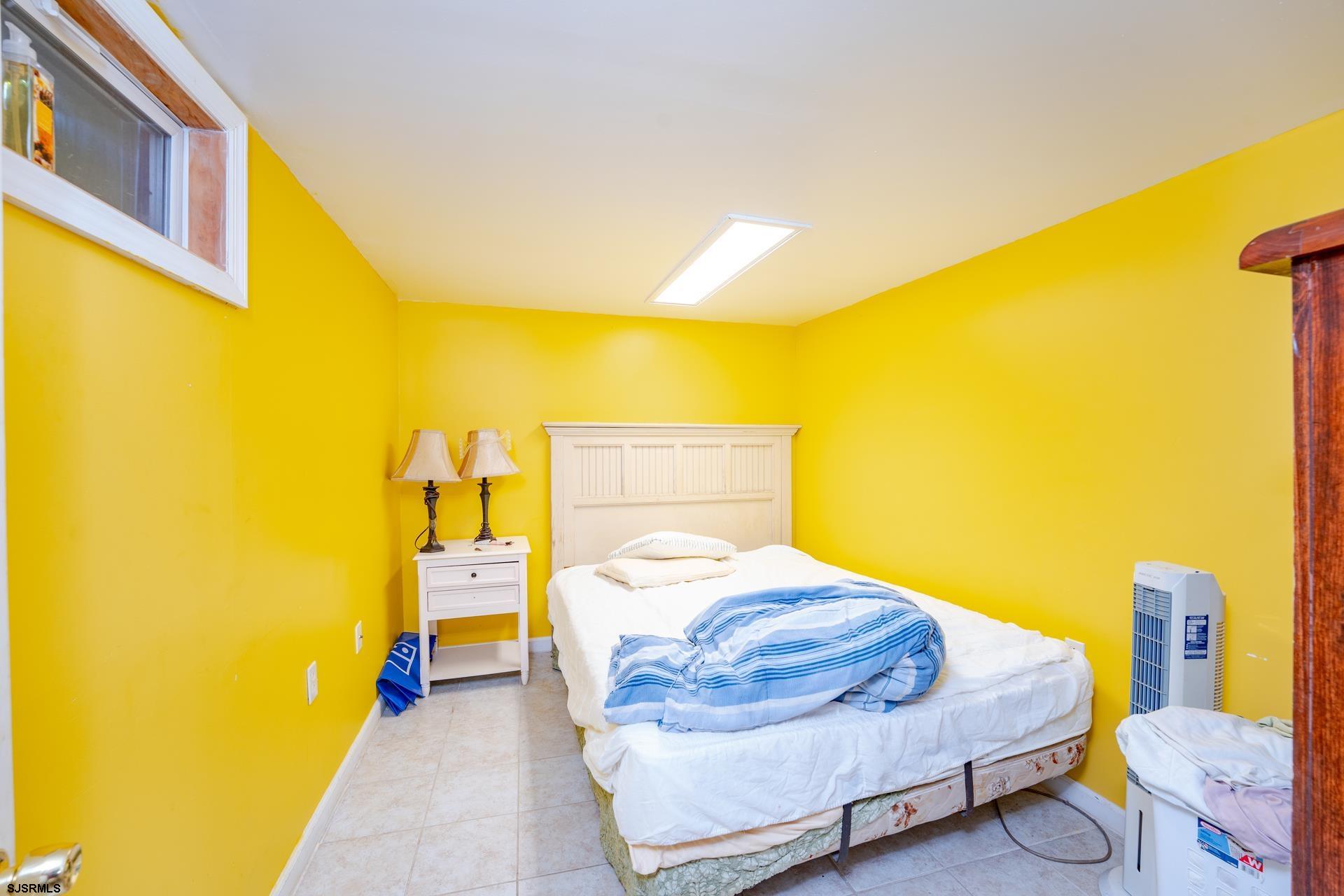 6529 Delilah Road Egg Harbor Township, NJ 08234 - Photo 25 of 70 a bedroom with a bed and wall painting