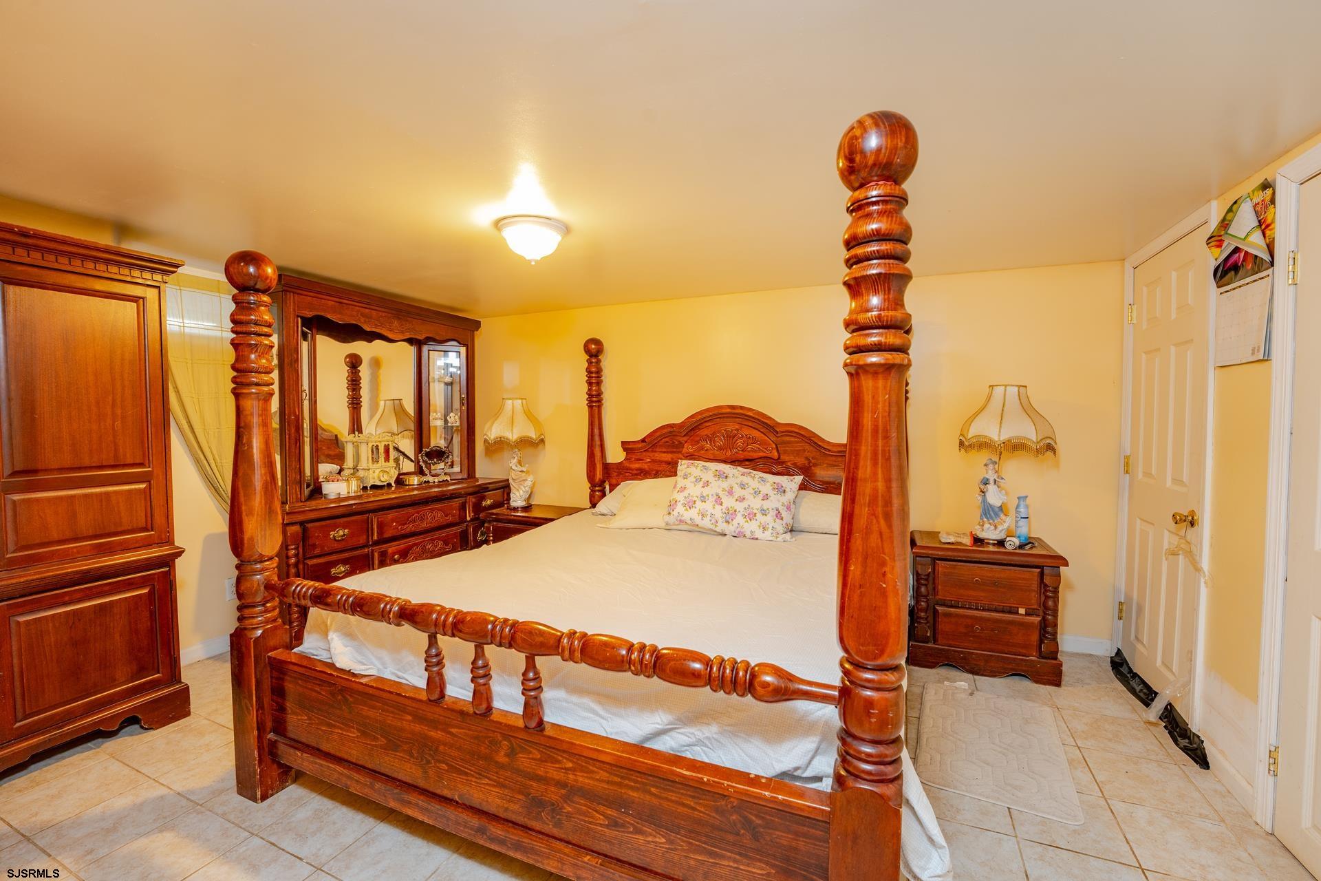 6529 Delilah Road Egg Harbor Township, NJ 08234 - Photo 27 of 70 a bedroom with a bed and a window
