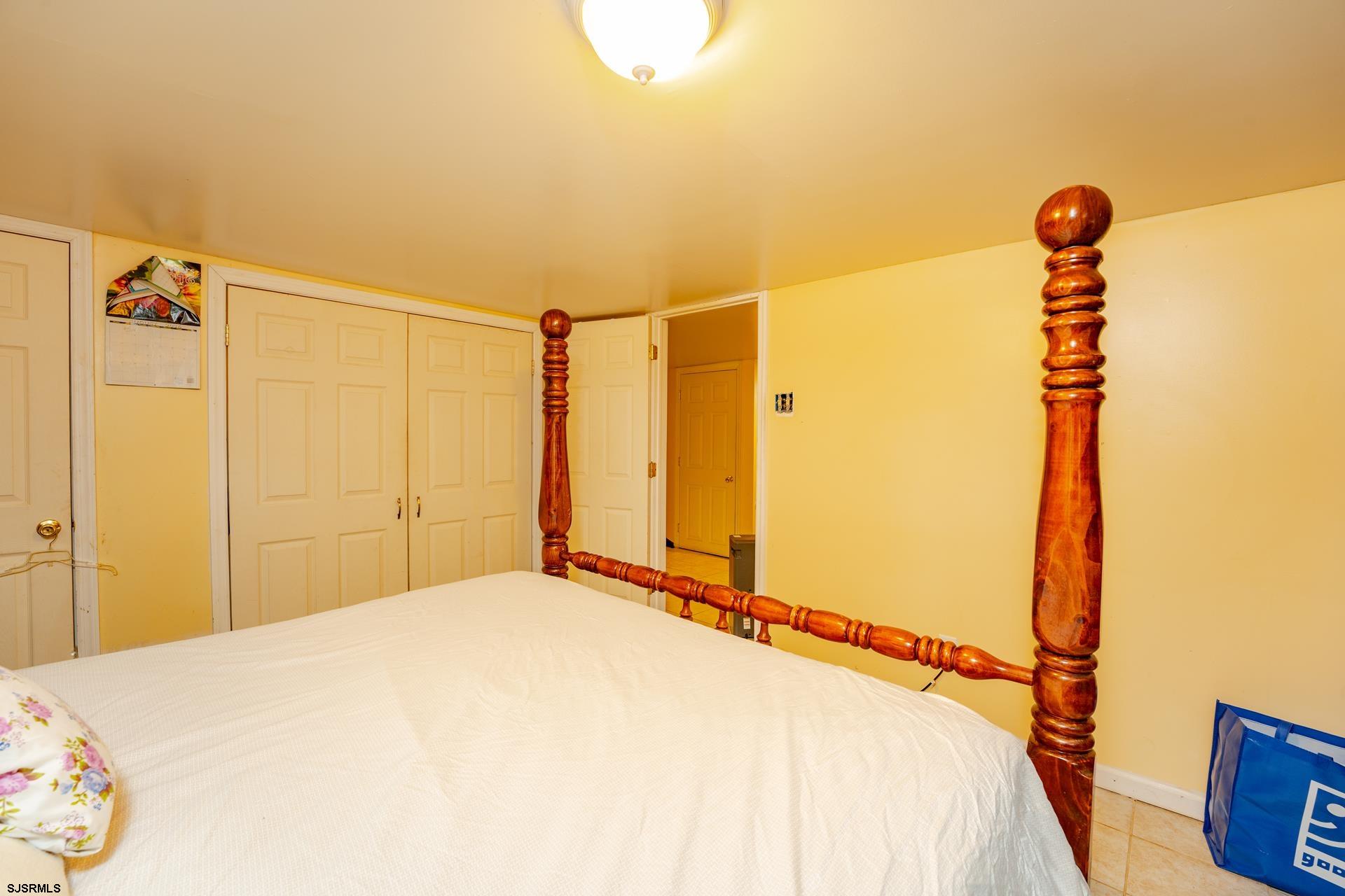 6529 Delilah Road Egg Harbor Township, NJ 08234 - Photo 28 of 70 a bedroom with a bed and a shower
