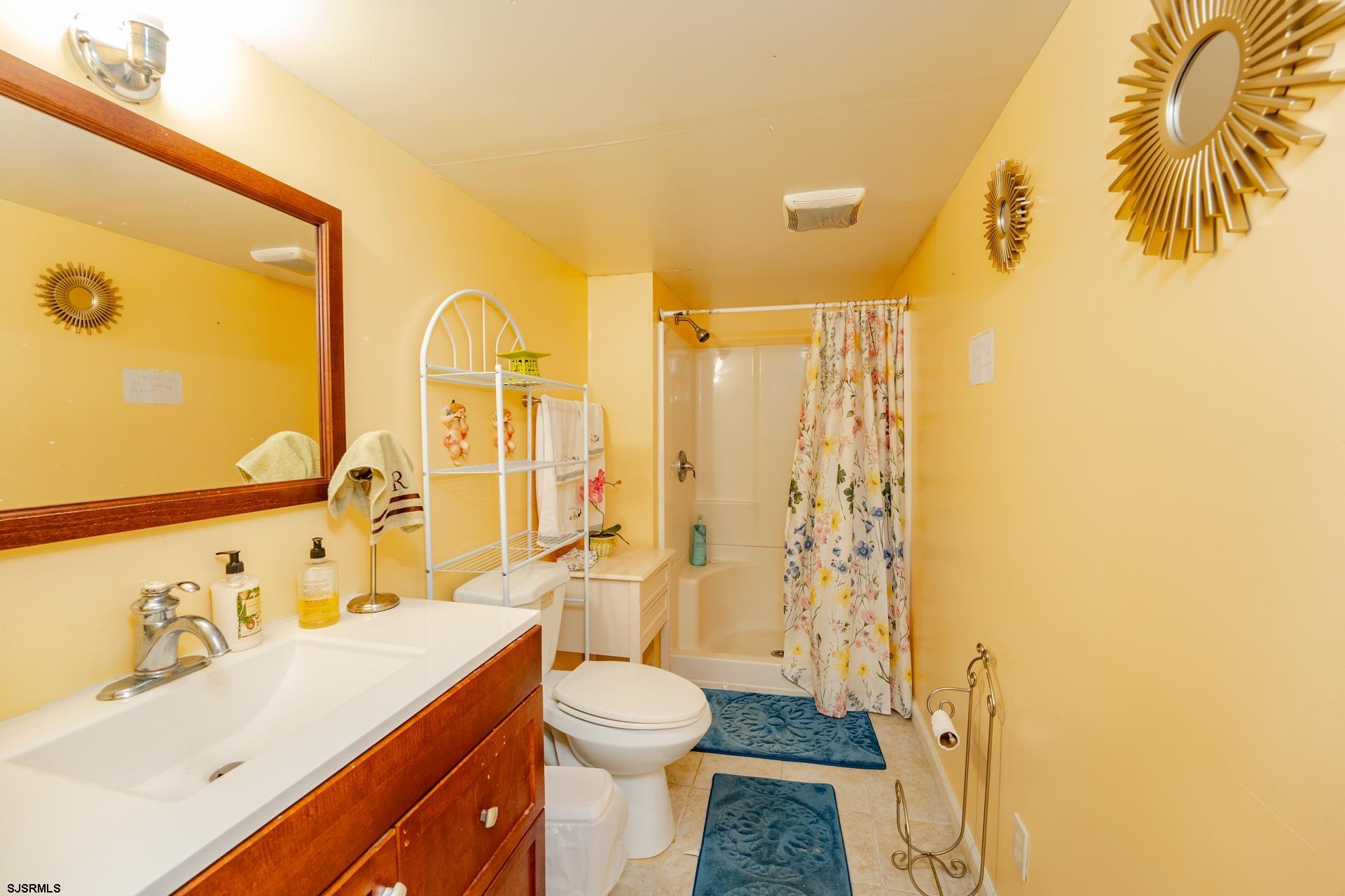6529 Delilah Road Egg Harbor Township, NJ 08234 - Photo 29 of 70 a bathroom with a sink and a mirror