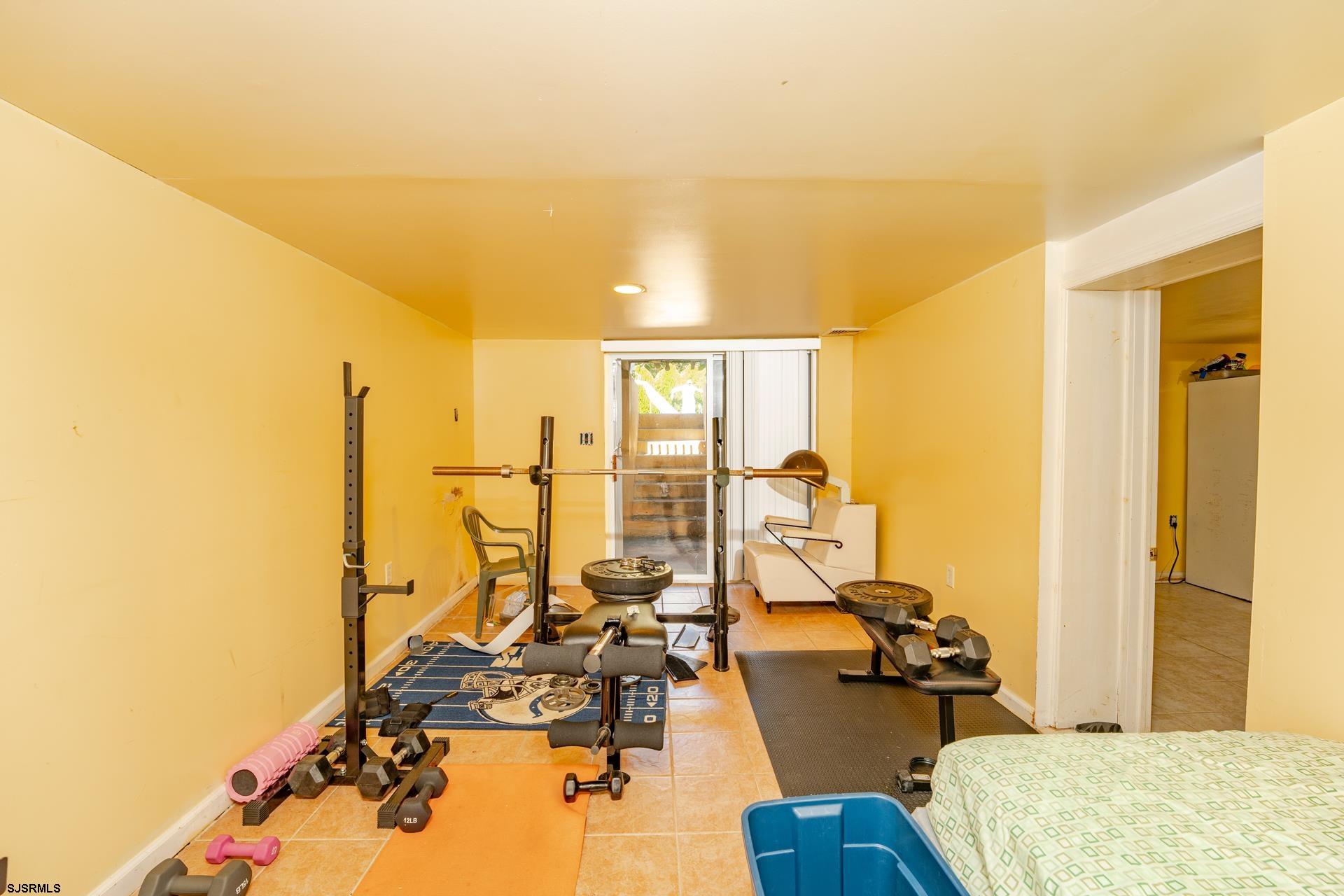 6529 Delilah Road Egg Harbor Township, NJ 08234 - Photo 31 of 70 a view of a workspace with furniture and floor to ceiling window