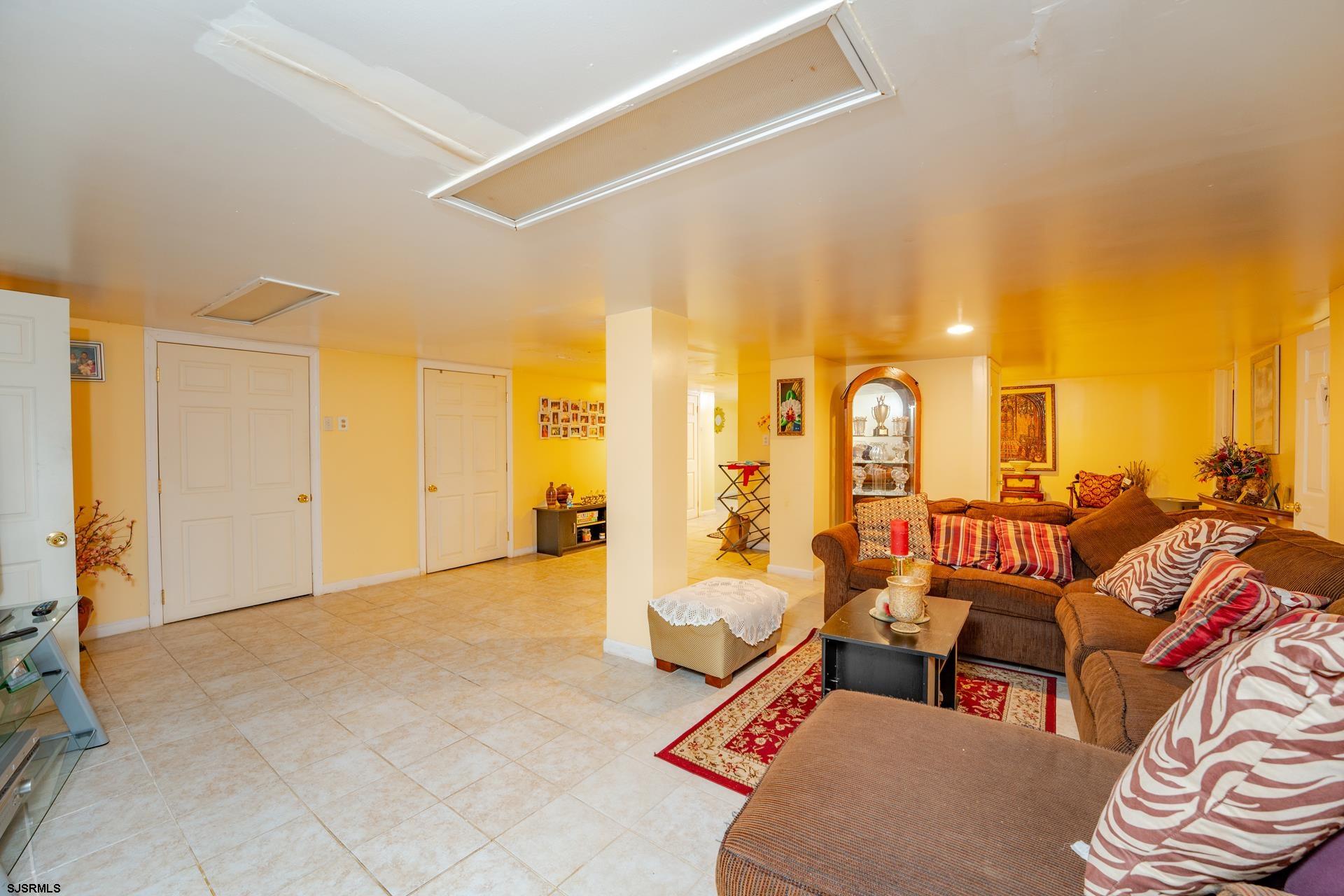 6529 Delilah Road Egg Harbor Township, NJ 08234 - Photo 34 of 70 a living room with furniture and a large window