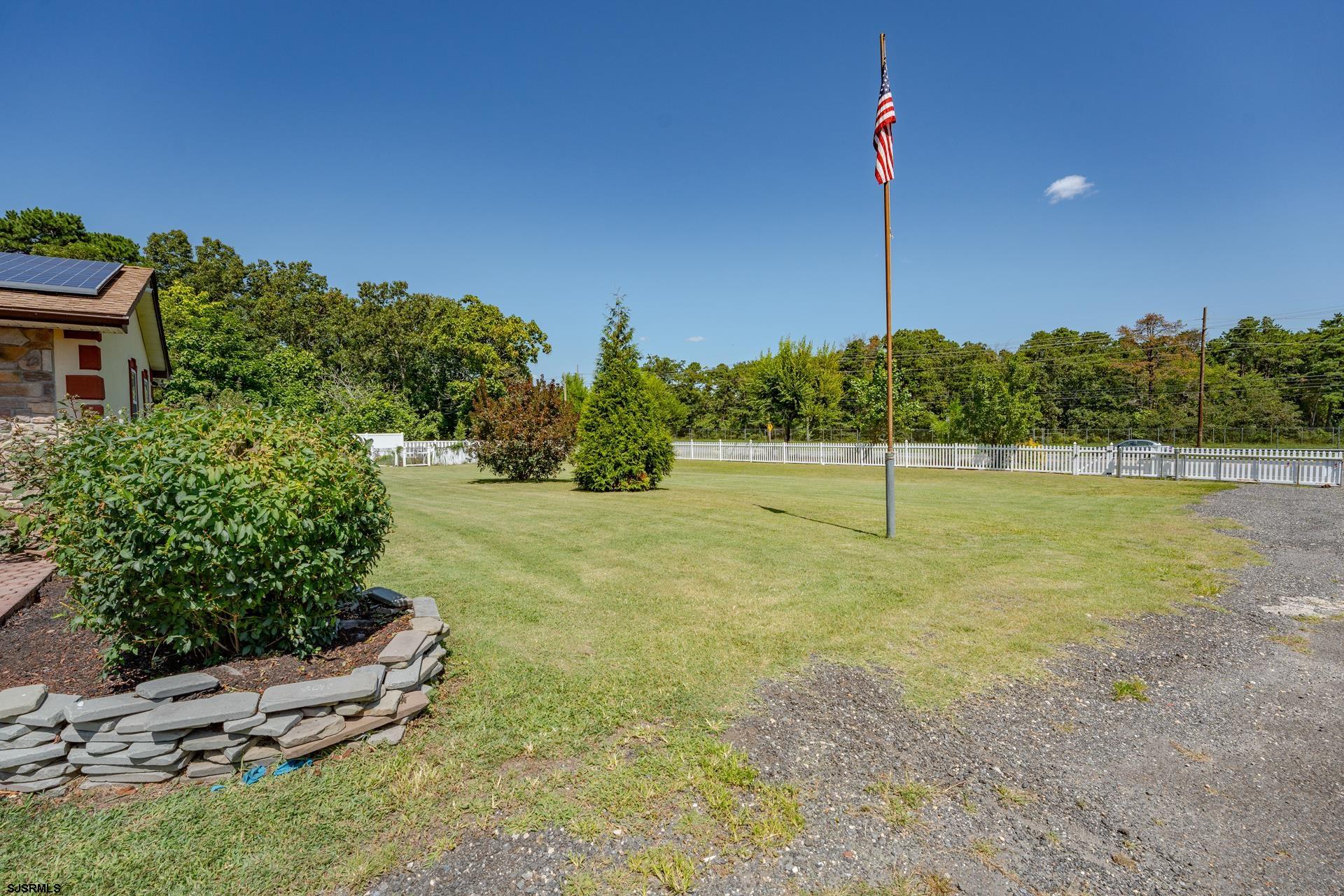 6529 Delilah Road Egg Harbor Township, NJ 08234 - Photo 4 of 70 a view of a bench in a yard