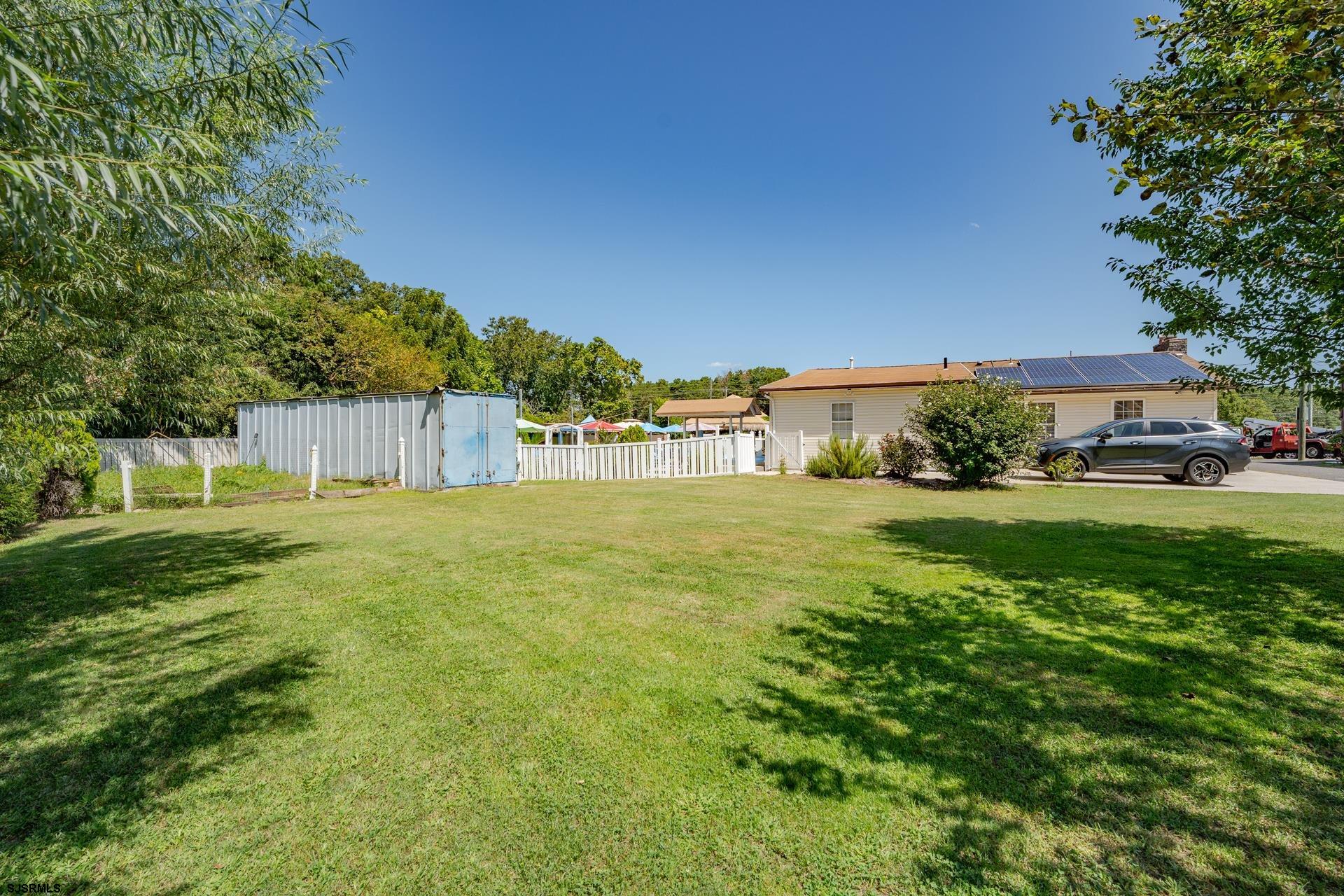 6529 Delilah Road Egg Harbor Township, NJ 08234 - Photo 41 of 70 a view of yard with swimming pool and green space