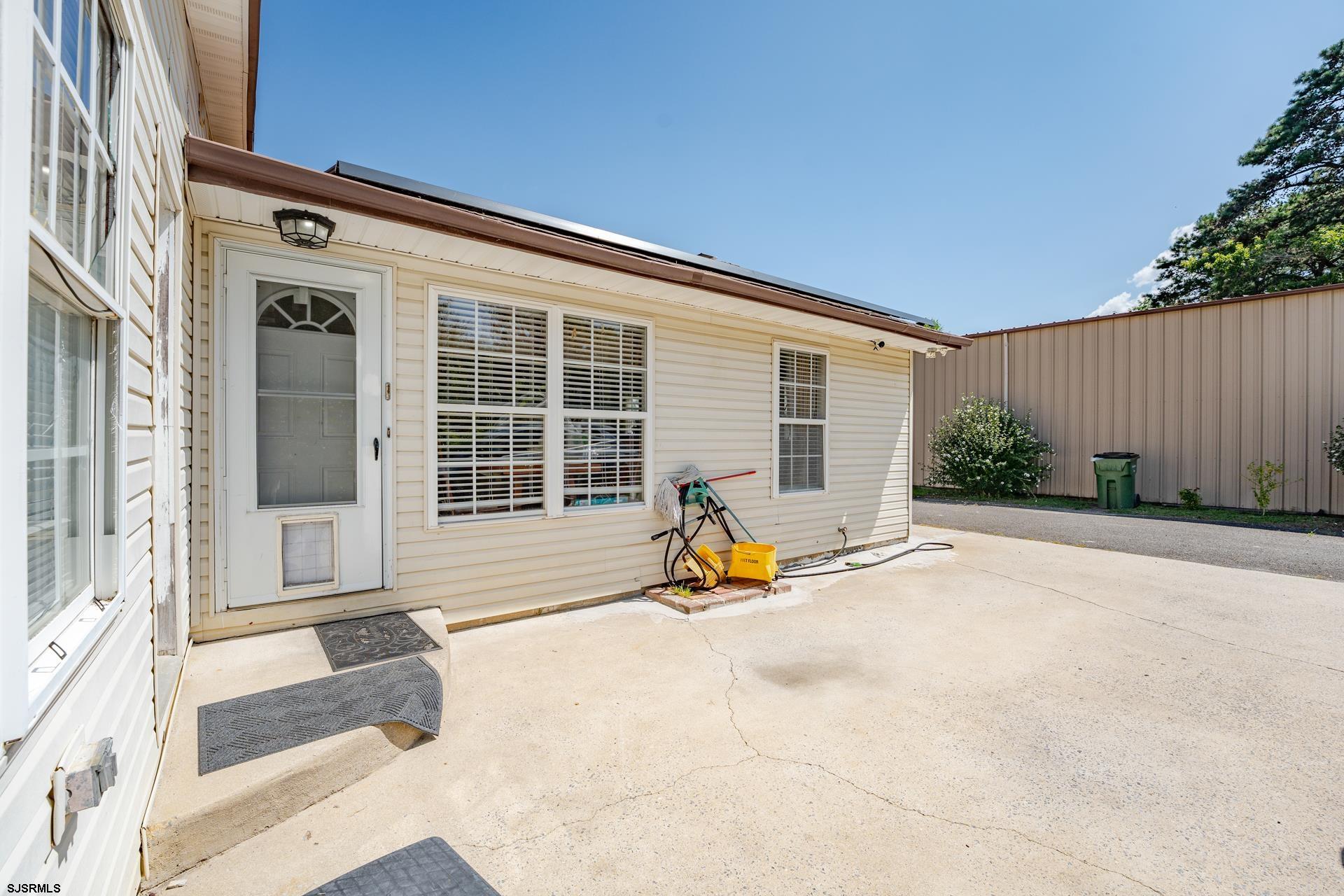 6529 Delilah Road Egg Harbor Township, NJ 08234 - Photo 44 of 70 a view of a house with backyard and sitting area