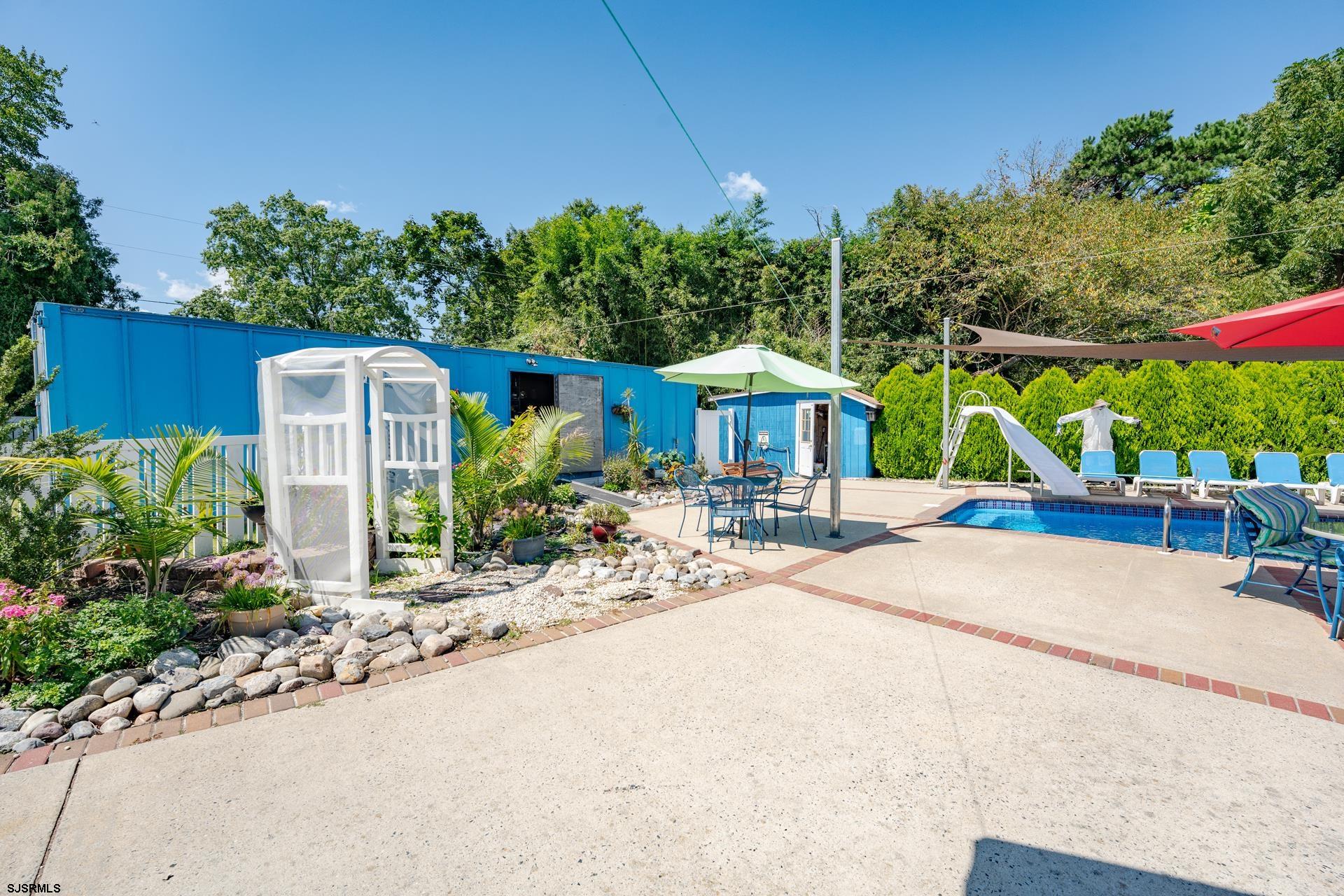 6529 Delilah Road Egg Harbor Township, NJ 08234 - Photo 48 of 70 a front view of a house with garden