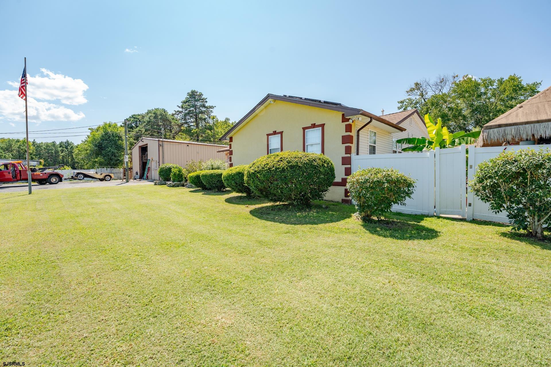 6529 Delilah Road Egg Harbor Township, NJ 08234 - Photo 5 of 70 a front view of house with yard and green space