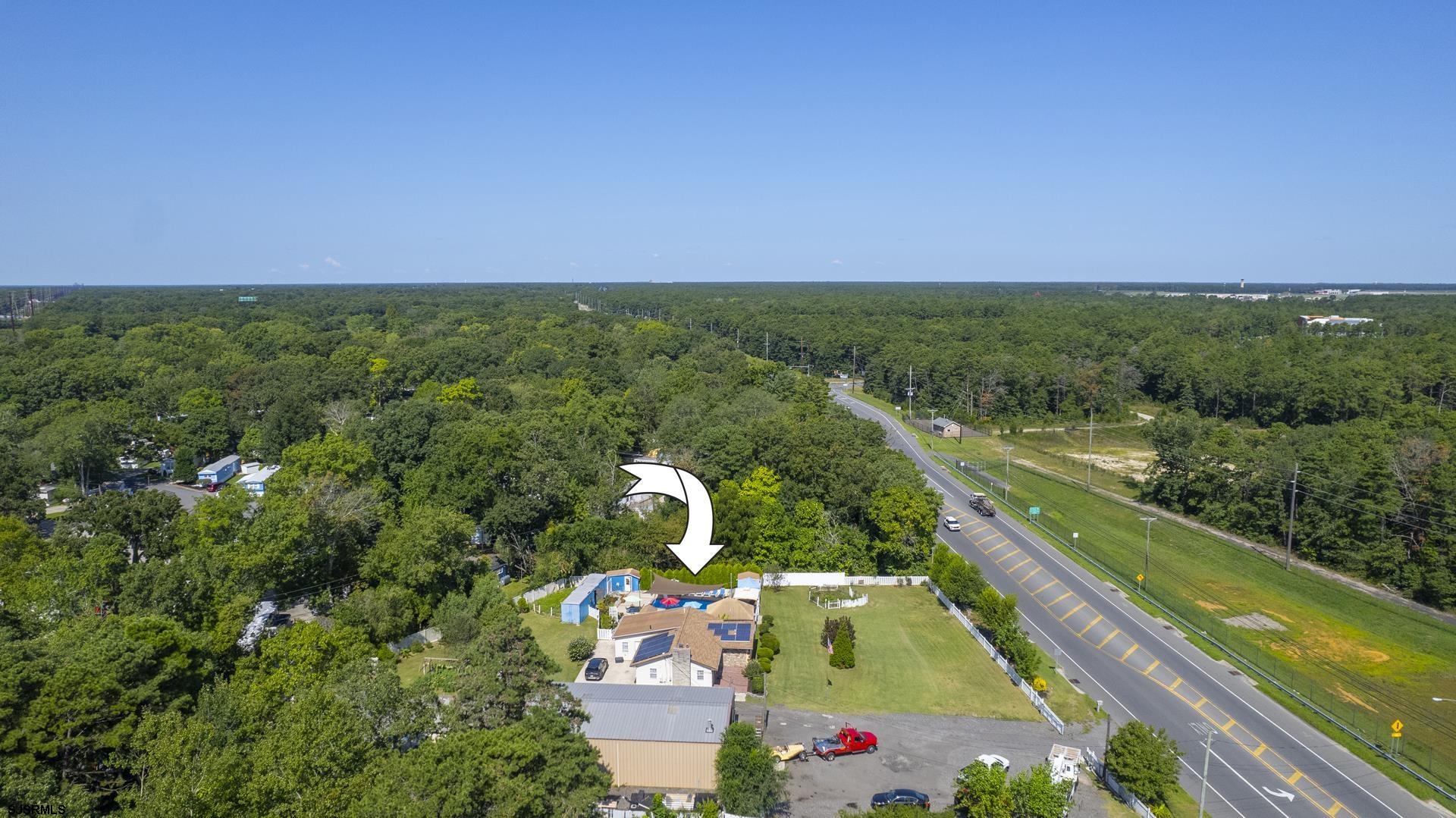 6529 Delilah Road Egg Harbor Township, NJ 08234 - Photo 61 of 70 a view of a city from a balcony with two chairs