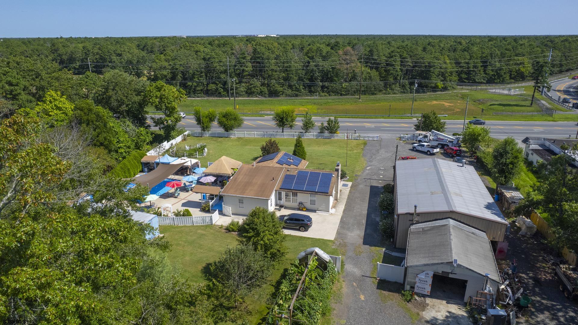 6529 Delilah Road Egg Harbor Township, NJ 08234 - Photo 64 of 70 an aerial view of a house with swimming pool garden and outdoor seating