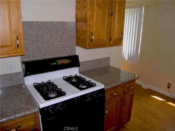 a kitchen with a stove and a cabinet