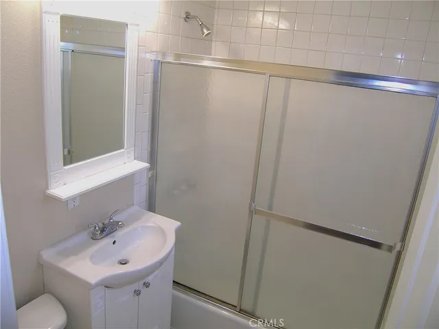 a bathroom with a sink and mirror
