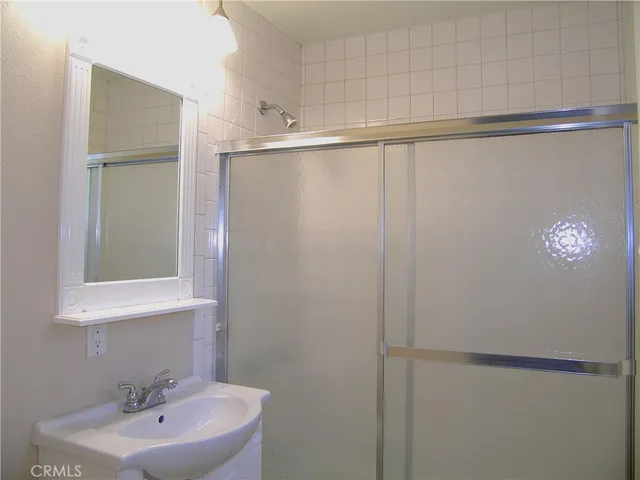 a bathroom with a sink and mirror
