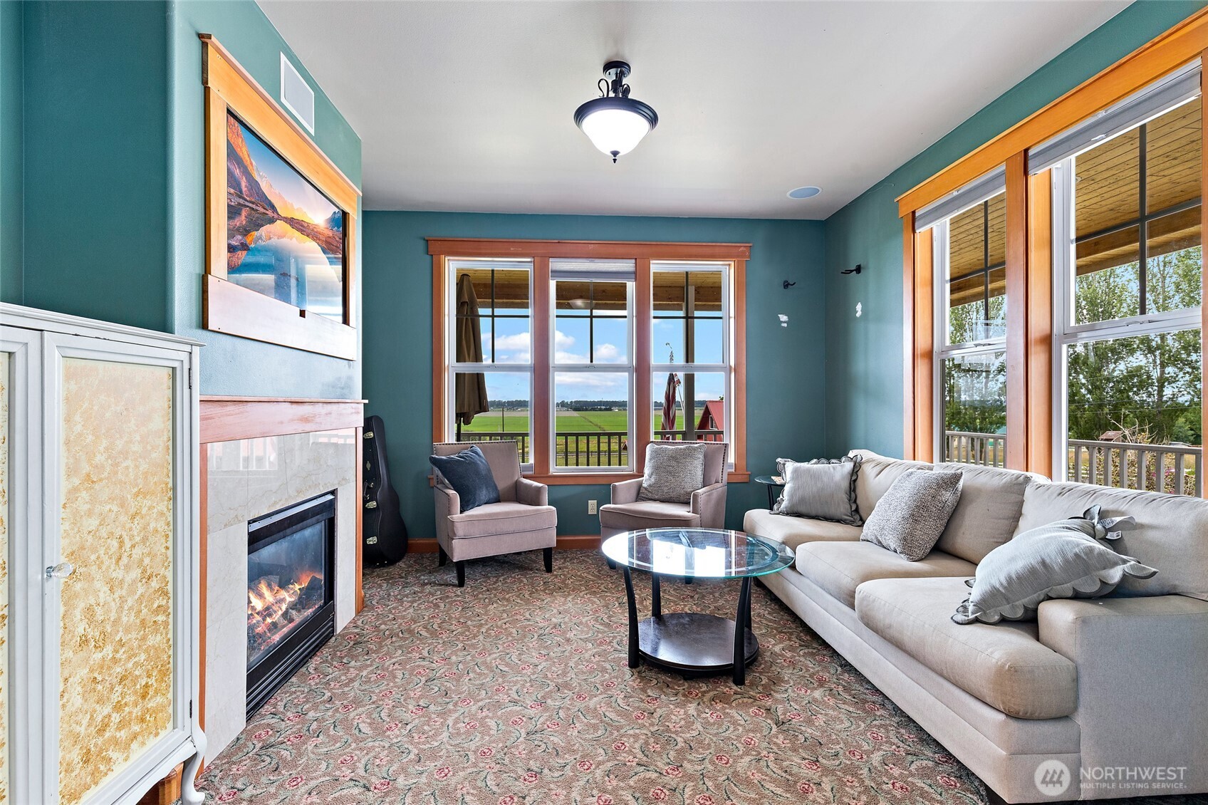 20076 Sinnes Road Mount Vernon, WA 98274 - Photo 13 of 40 a living room with furniture fireplace and a large window