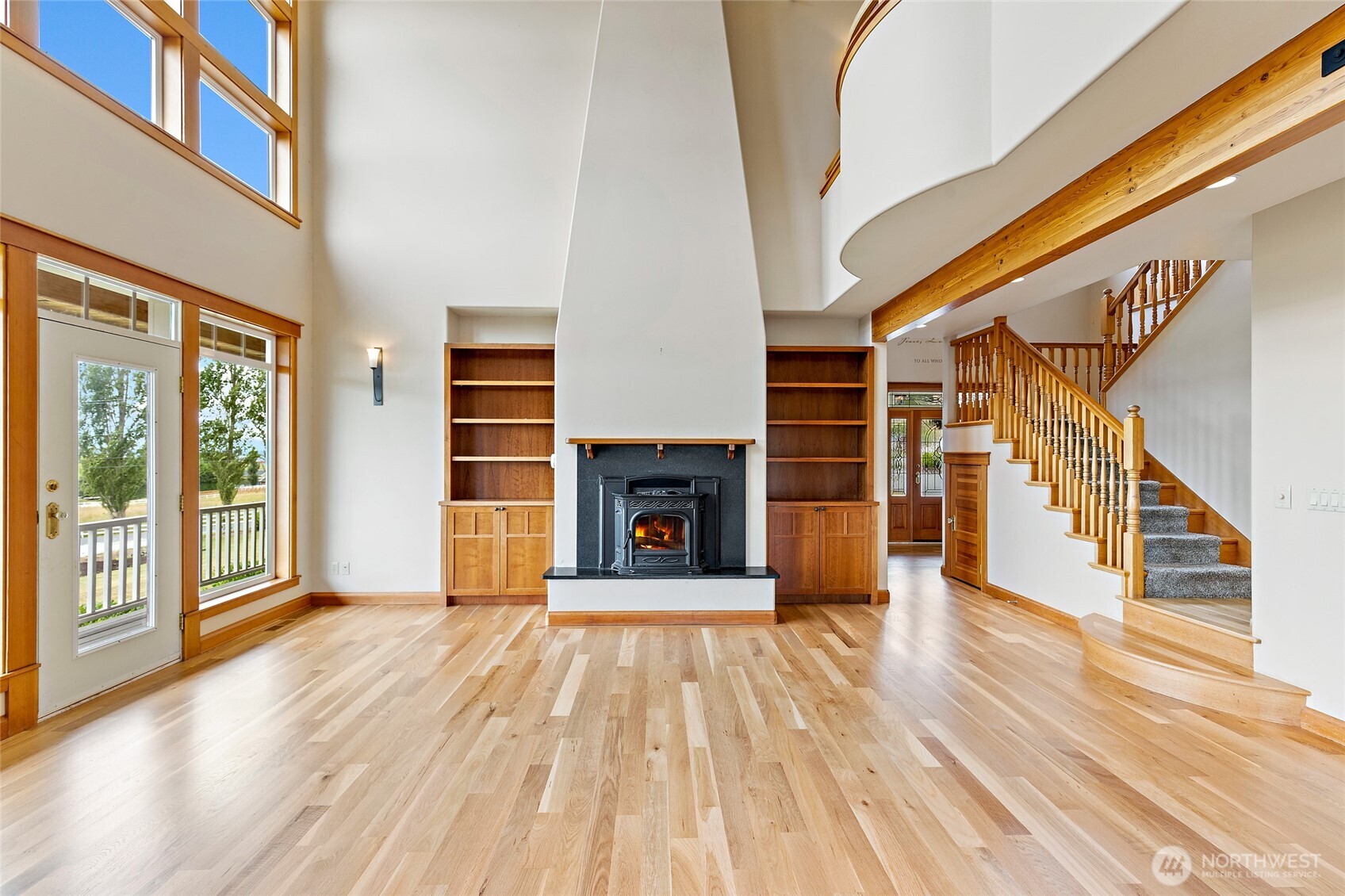 20076 Sinnes Road Mount Vernon, WA 98274 - Photo 5 of 40 a view of a livingroom with wooden floor fireplace and windows