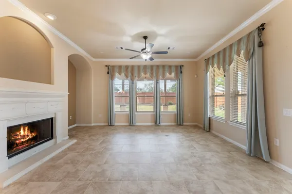 a view of a hall with a ceiling fan