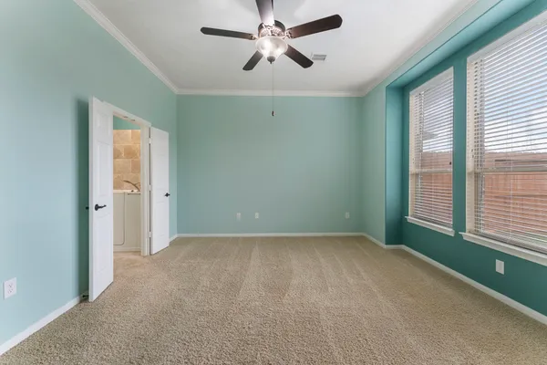 an aerial view of a swimming pool with lounge chairs