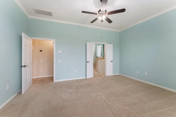 an aerial view of a house with a lake view