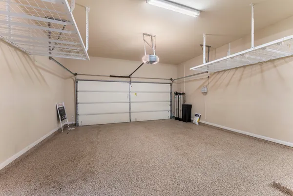 a kitchen with large window a sink and a counter top space