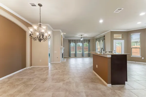 a kitchen with granite countertop stainless steel appliances and wooden cabinets