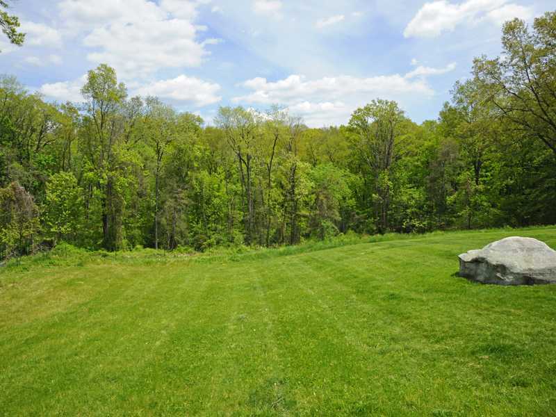 407 Round Hill Road Greenwich, CT 06831 - Photo 20 of 21 a view of a grassy field