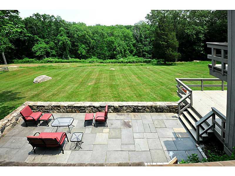 407 Round Hill Road Greenwich, CT 06831 - Photo 5 of 21 a view of yard with seating area
