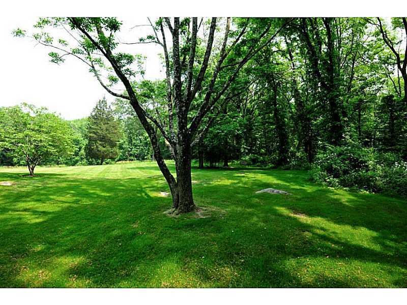 407 Round Hill Road Greenwich, CT 06831 - Photo 6 of 21 a view of an trees with a yard