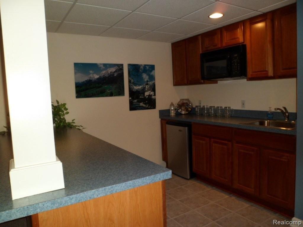 11102 Pinehurst Road, Unit 27 Plymouth, MI 48170 - Photo 19 of 25 Kitchenette in Basement