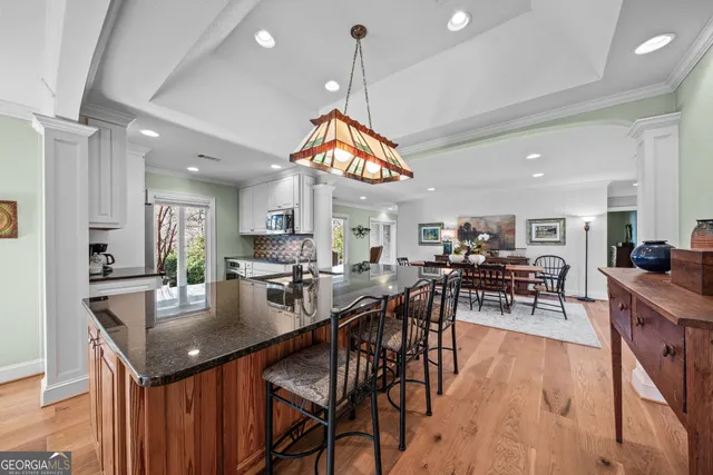 a view of a dining room with furniture and wooden floor