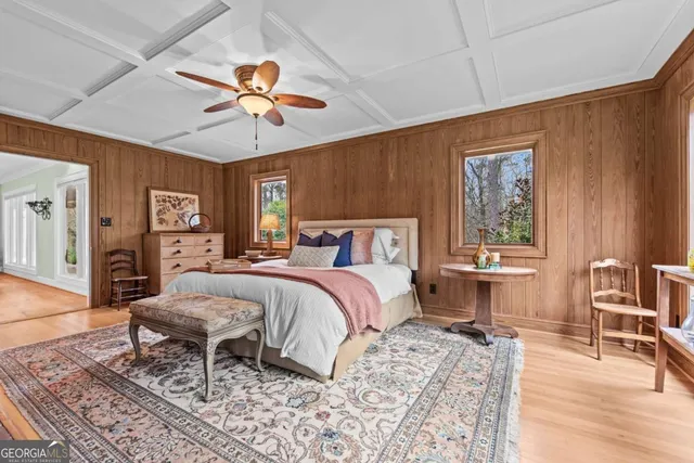 a bathroom with a granite countertop sink a mirror and a shower