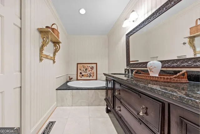 a kitchen with stainless steel appliances granite countertop a sink and a refrigerator