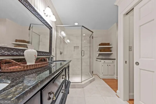 a bed room with a bed and a chandelier