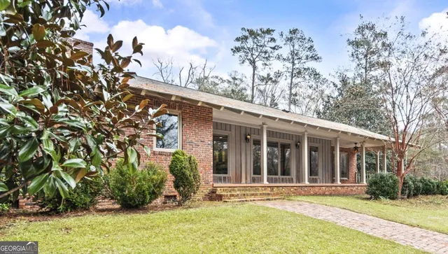 front view of a building with a yard