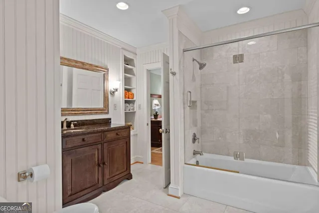 a bedroom with a bed and a mirror