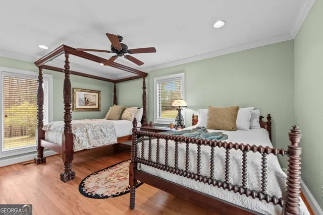 a view of a hallway with wooden floor and closet