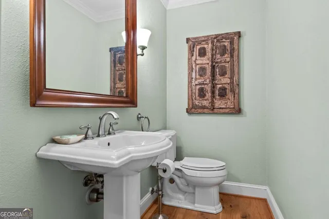 a kitchen with stainless steel appliances granite countertop a stove and a wooden floors