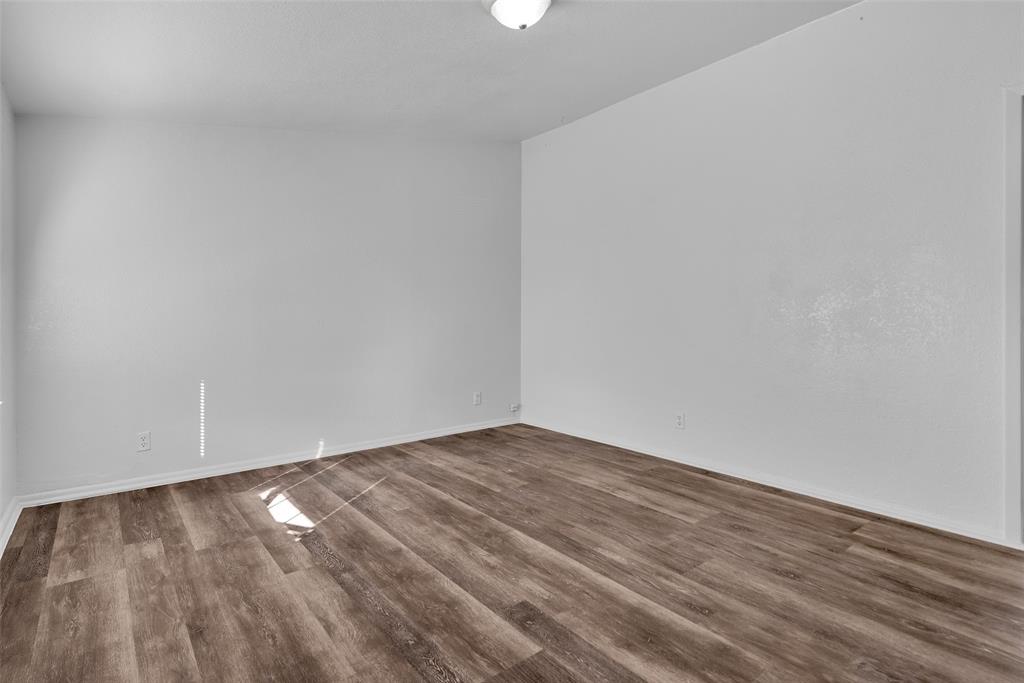 515 Forrest Lane Denison, TX 75021 - Photo 2 of 15 a view of empty room with wooden floor