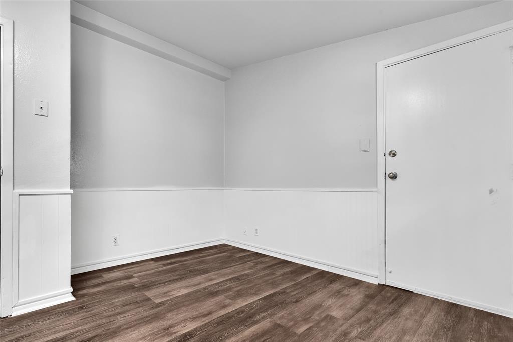 515 Forrest Lane Denison, TX 75021 - Photo 7 of 15 an empty room with wooden floor