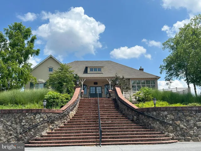 a view of a patio with chair and tables