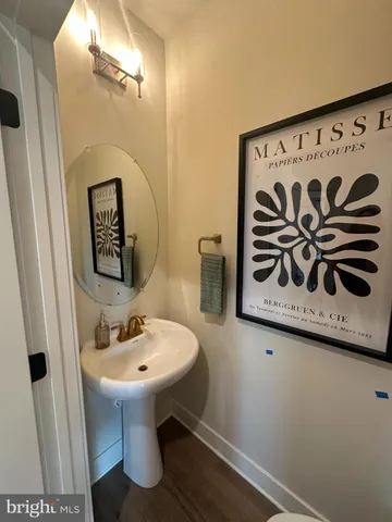 a bathroom with a sink and mirror