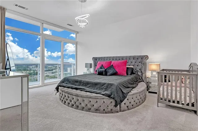 a bedroom with a bed and glass window