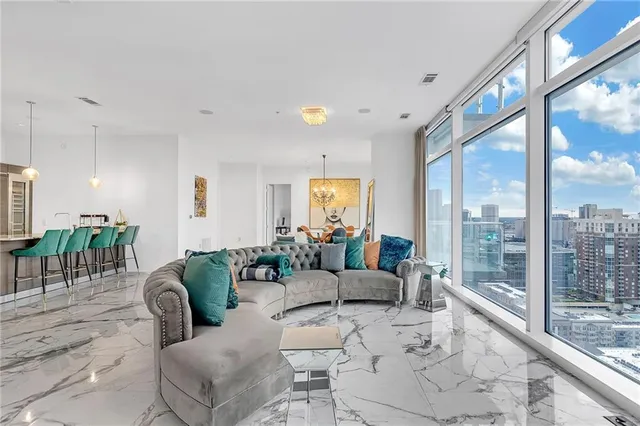 a living room with furniture and a large window