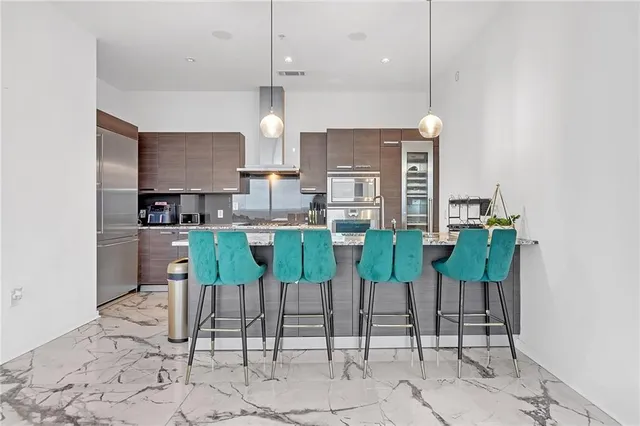 a view of kitchen with table and chairs